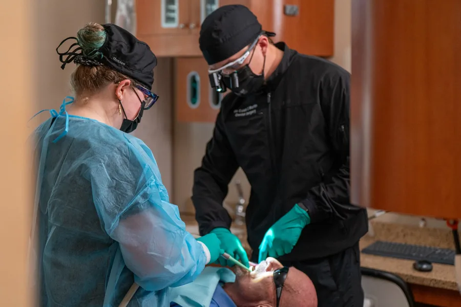 Caleb Martin and a dental assistant providing care