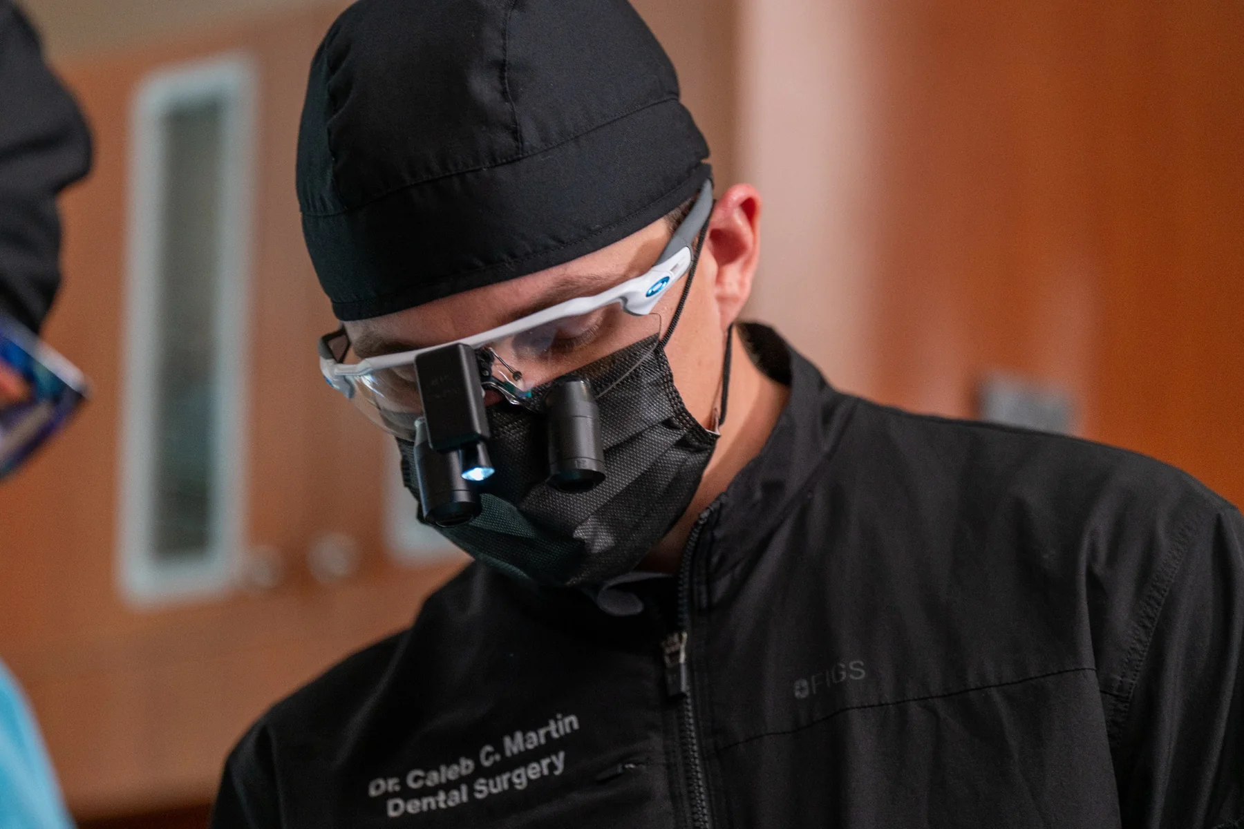 Caleb Martin using magnification during dental surgery