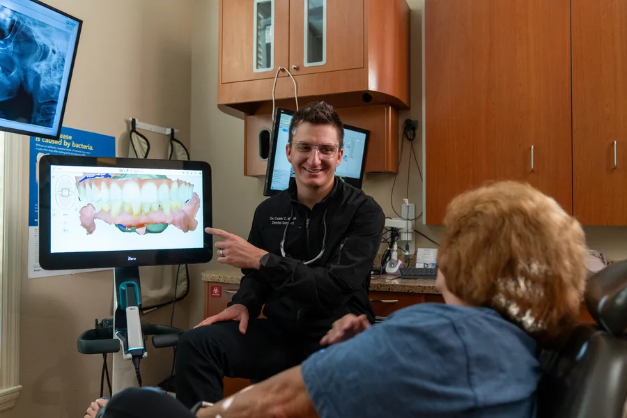 Caleb Martin explaining an intraoral scan to a patient