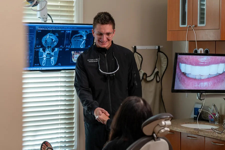 Caleb Martin greeting a dental patient